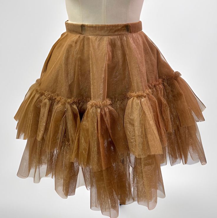 The Estelle mini ruffled skirt features an elastic waist band ,functional side pockets ,two layers of tulle fabric and ruffle designs. Perfect for minimalistic cute girl look! skirt/ruffled/cute outfit/short skirt/casual/party outfit Full Petticoat With Ruffles For Party, Party Skirted Petticoat With Ruffles, Party Petticoat With Ruffles And Flared Skirt, Balletcore Mini Skirt With Ruffles, Summer Balletcore Petticoat With Ruffles, Party Petticoat With Gathered Tiered Skirt, Party Petticoat With Ruffled Skirt, Voluminous Ruffled Petticoat, Party Skirt With Tiered Ruffles