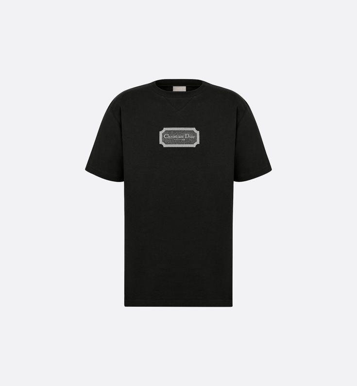 The T-shirt is a relaxed and modern piece. Crafted in black cotton jersey, it features a Christian Dior Couture signature in a contrasting embroidered frame on the chest. Thanks to its relaxed fit and ribbed crew neck with V-neck topstitching, the T-shirt will pair effortlessly with any jeans for a contemporary look.. Denim Swimsuit, Versace Jacket, Off White Jacket, Burberry T Shirt, Dior Star, Versace T Shirt, Versace Sweatshirt, Mens Casual Dress Outfits, Christian Dior Couture