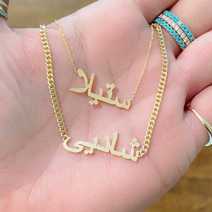 "This unique personalized single name cut-out necklace is composed of 14K solid gold and beautifully complemented by a durable 14K solid gold adjustable chain. This design is also available to be purchased as a charm alone without the chain. NOTE: Kindly indicate the language desired (i.e. Hebrew, Farsi, or Arabic) in the \"Notes\" section upon checkout. ♦Name Dimensions: approximately 7mm high x width depending on the names desired ♦ Pendant Thickness: approximately 1mm ♦ Metal Finish: High Shi Adjustable Chain Nameplate Necklace, Custom Engraved Gold Plated Nameplate Necklace, Gold Plated Custom Nameplate Necklace, 14k Gold Nameplate Necklace With Adjustable Chain, Custom Name Gold Plated Nameplate Necklace, 14k Gold Necklace With Adjustable Chain For Personalized Gift, Personalized 14k Gold Necklace With Adjustable Chain, Customizable Gold Plated Yellow Gold Name Necklace, Rose Gold Nameplate Necklace With Adjustable Chain