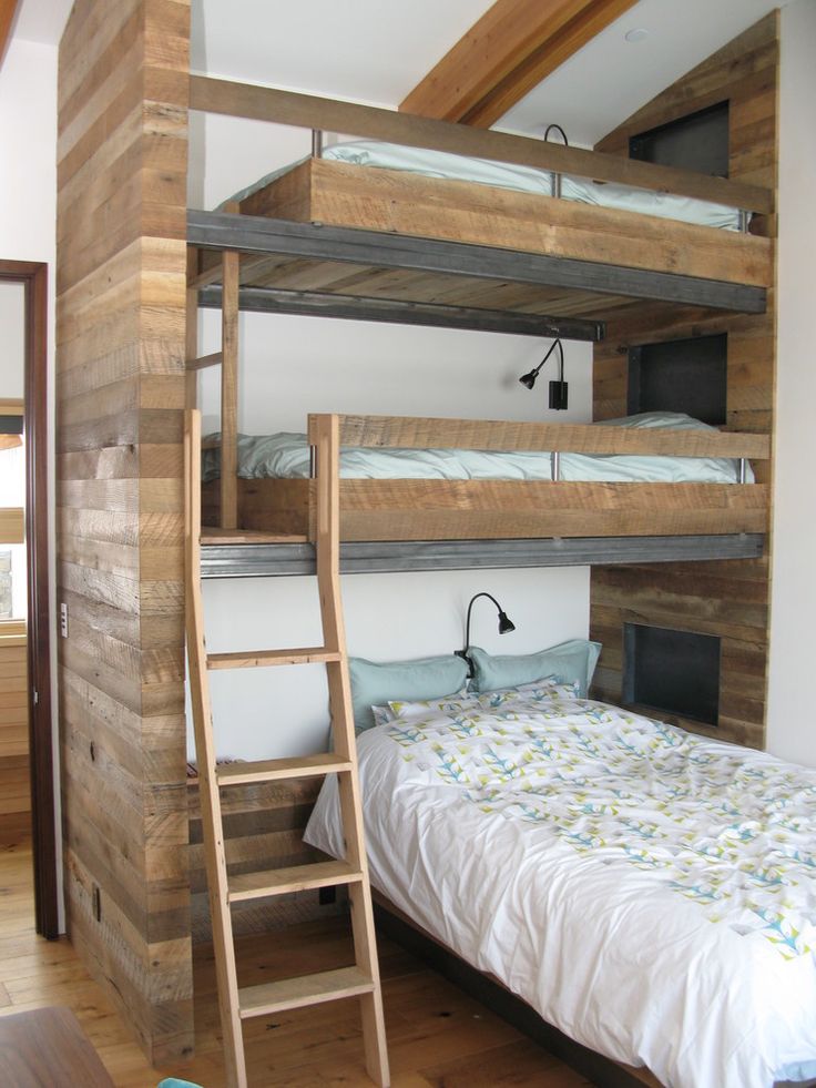 the bunk bed is made from wood and has two ladders