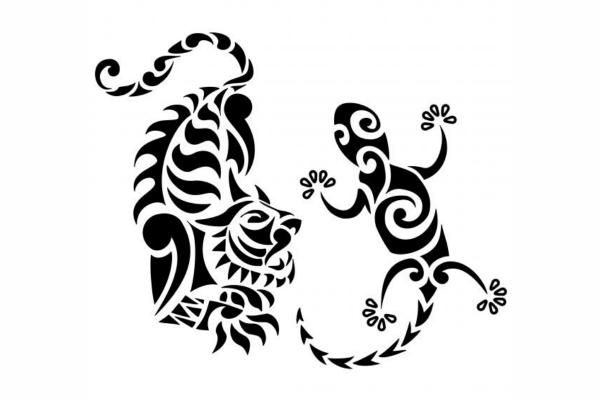 two black and white lizards with swirly designs on their body, one is facing each other