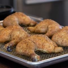 several pieces of chicken sitting on top of a metal pan