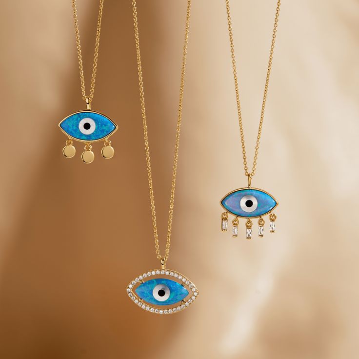 A stunning range of jewelry with a distinctive exotic look incorporating designs which include the Divine Eye and Hand of Fatima/Hamsa. Metal: 925 Sterling Silver Plating: 18K Gold Stones: Synthetic Opal 8X16 MM, AAA Grade Cubic Zirconia Length: 16" +2" Extension Lower Lashes, Synthetic Opal, Hand Of Fatima, Eye Necklace, Evil Eye, Lab Grown, Cubic Zirconia, Lashes, 18k Gold