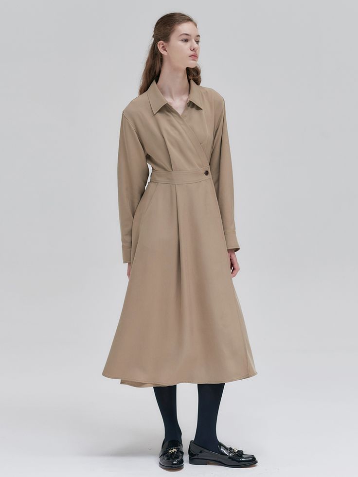 Editor's NotesThis is a long-sleeved dress designed in a shirt-like top in a wrap style.  It features a neat collar detail and a subtle fit-and-flare silhouette, expressing minimalistic femininity. - Crafted from flexible Tencel material, creating a soft and feminine silhouette- Button detail on the waistline for a desired fit- High-waisted banding that allows legs to appear longer- Hidden pockets that does not interfere with neat look- Natural draping that creates flow with movement- Classic V-neck Shirt Dress For Work, Classic Long Sleeve Midi Dress For Work, Fitted Long Sleeve Shirt Dress With Hidden Button Closure, Long-sleeved Belted Dress For Business Casual, Fall Office Shirt Dress With Spread Collar, Belted Long Sleeve Dress For Business Casual, Belted Long Sleeve Shirt Dress For Semi-formal Occasions, Fall Long Sleeve Office Midi Dress, Classic Long Sleeve Midi Dress For Business Casual