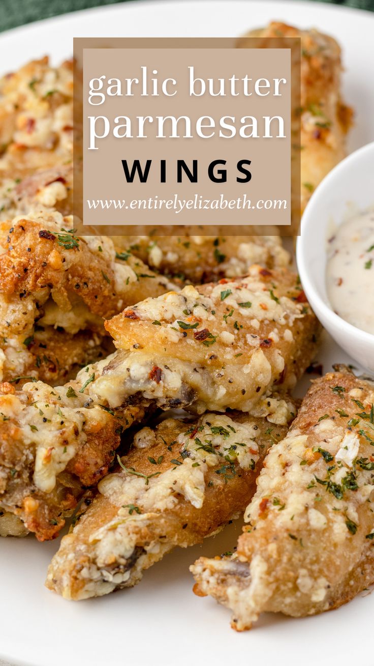 garlic butter parmesan wings on a plate with dipping sauce