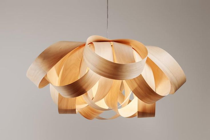 a wooden chandelier hanging from a ceiling with light wood strips attached to it