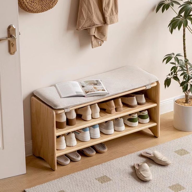 a wooden shoe rack sitting next to a door