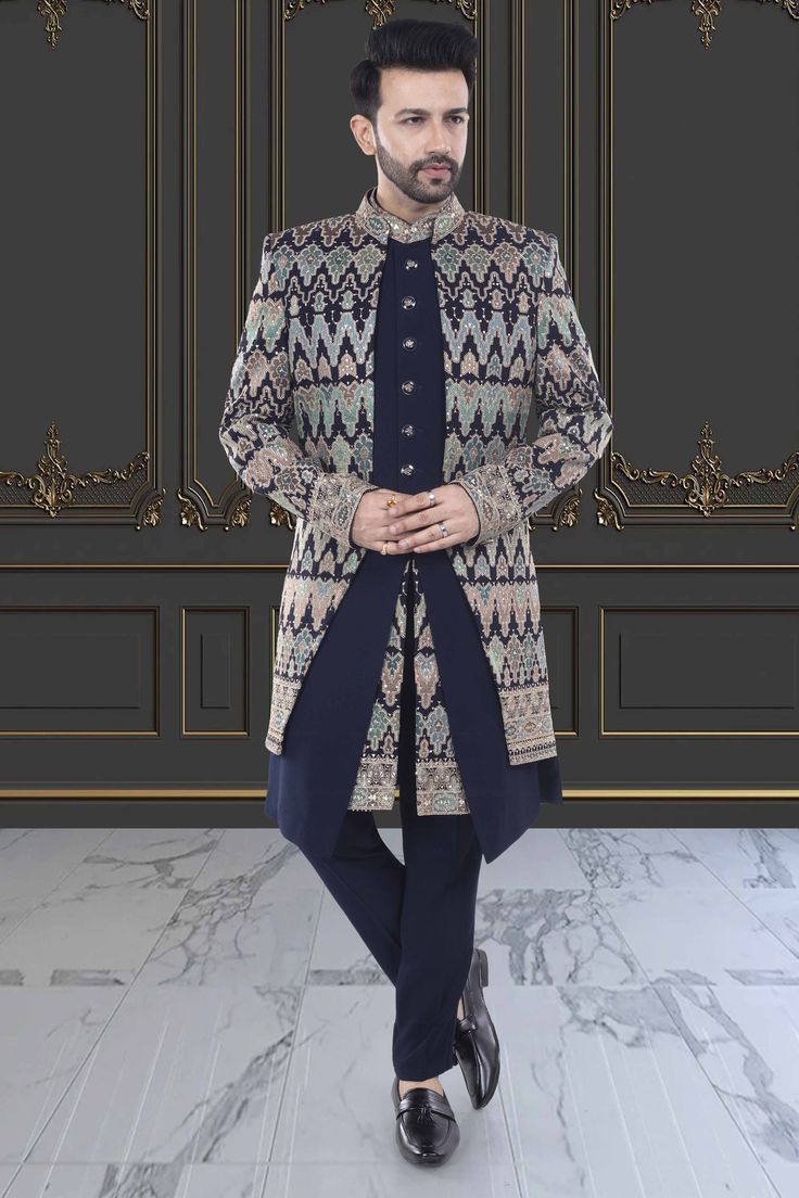 This Mens Sherwani is expertly designed with a unique open jacket style and adorned with intricate sequin and thread embroidery. Elevate your formal look with this exquisite piece, perfect for traditional events and special occasions. Enjoy the timeless elegance and sophisticated craftsmanship of this U2-S378 sherwani. Traditional Festive Winter Suit, Traditional Winter Festive Suits, Bollywood Style Formal Outerwear For Eid, Formal Outerwear With Zari Work For Transitional Season, Bollywood Style Sherwani With Intricate Embroidery For Formal Occasions, Winter Bollywood Sherwani With Dabka Embroidery, Formal Outerwear With Zari Work In Traditional Drape, Designer Traditional Wear For Winter, Traditional Formal Outerwear With Traditional Drape