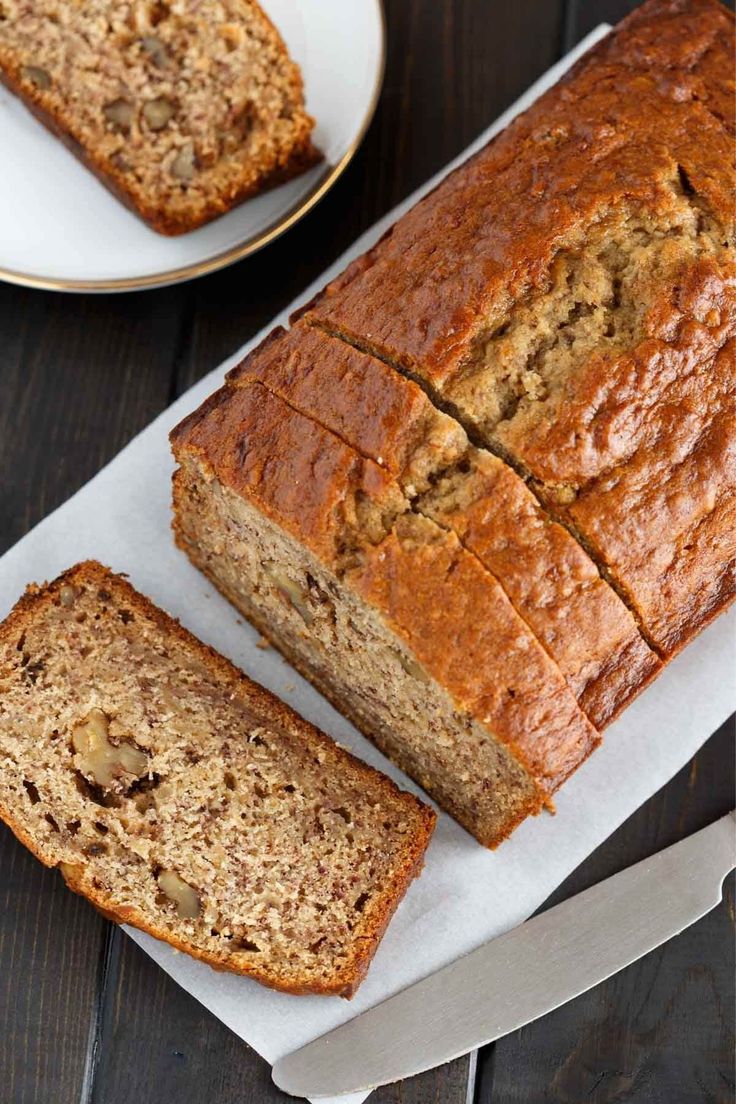 two slices of banana bread sitting on top of a cutting board