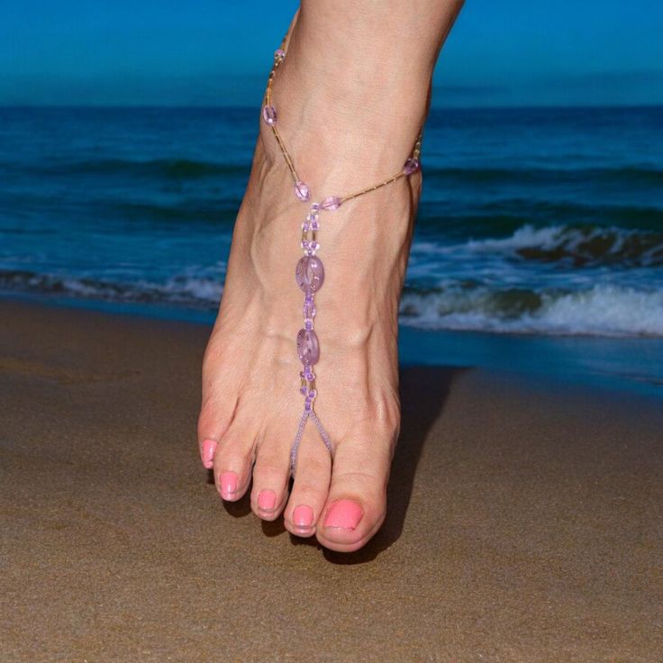 Homemade barefoot sandals. They may be too late to wear to  the lake this year but not too late  for vacations to warm places.  The foot jewelry is made with a stretch cord and fits shoe sizes 7.5 to 9. They can be remade to your shoe size. The sandals are made with purple acrylic beads and gold glass beads. Purple Adjustable Sandals For Party, Adjustable Open Toe Pink Barefoot Sandals, Adjustable Open Toe Gold Barefoot Sandals, Adjustable Pink Open Toe Barefoot Sandals, Pink Adjustable Barefoot Sandals, Handmade Adjustable Pink Barefoot Sandals, Adjustable Purple Anklets, Adjustable Purple Sandals For Beach, Gold Open Toe Barefoot Sandals For Beach