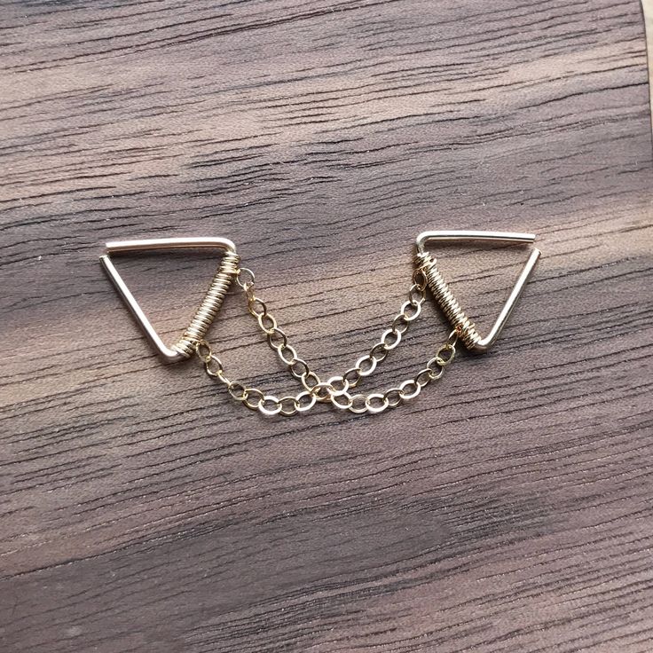 ♥Simply♥Dainty♥Everyday♥Minimal♥ 14k gold filled 14k Rose Gold filled 925 sterling silver Triangle gauge: 24 gauge/0.5mm 22 gauge/0.64mm 20 gauge/0.8mm Triangle inner dimensions: 8x8mm ---------------------------------------------------------- 14k gold filled Anyone who can wear gold can wear gold filled without worries of any allergic reaction to the jewelry. Gold filled jewelry is an economical alternative to solid gold! ---------------------------------------------------------- 100% handmade Industrial Earrings, Earring Piercing, Double Chain, Triangle Earrings, Gold Filled Jewelry, Piercing Jewelry, Gold Rose, Or Rose, Solid Gold