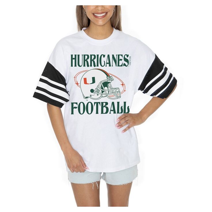 Showcase your Miami Hurricanes pride in style with the Gameday Couture Starting Lineup Contrast Sporty Heritage Oversized T-Shirt. The oversized fit provides a trendy and relaxed look, making it perfect for game day or any casual occasion. Made from 100% cotton, this tee offers exceptional comfort and breathability, ensuring you stay cool and confident while cheering on the Miami Hurricanes. Retro Oversized Tops For Game Day, Oversized Retro Top For Game Day, Oversized Collegiate Short Sleeve T-shirt, Retro Oversized T-shirt For College, Collegiate Oversized Tops With Logo Print, White Oversized Tops For School Spirit, White Slogan Top For Game Day, Oversized Collegiate T-shirt For Game Day, Oversized Varsity T-shirt For Game Day