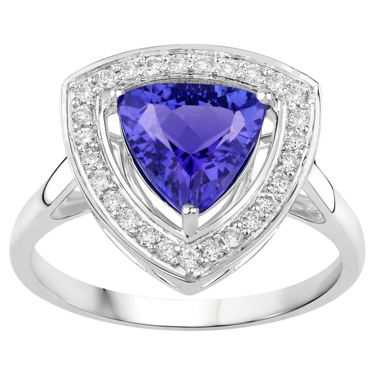 It comes with the Gemological Appraisal by GIA GG/AJP All Gemstones are Natural Tanzanite = 1.74 Carat 27 Diamonds = 0.22 Carats Metal: 14K White Gold Ring Size: 7* US *It can be resized complimentary Blue Engagement Ring, Sapphire Engagement Ring Blue, Tanzanite Ring, Modern Ring, Natural Tanzanite, White Gold Engagement, White Gold Engagement Rings, Blue Sapphire Rings, 14k White Gold Ring