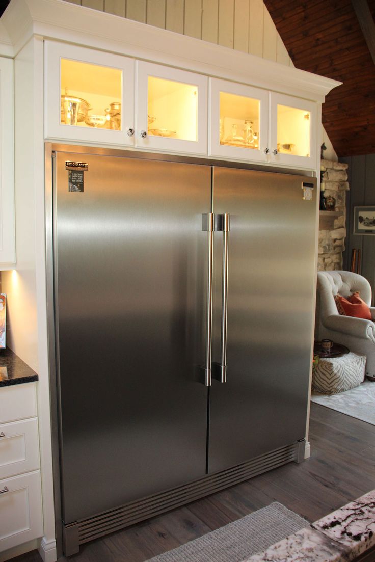 a large stainless steel refrigerator in a kitchen