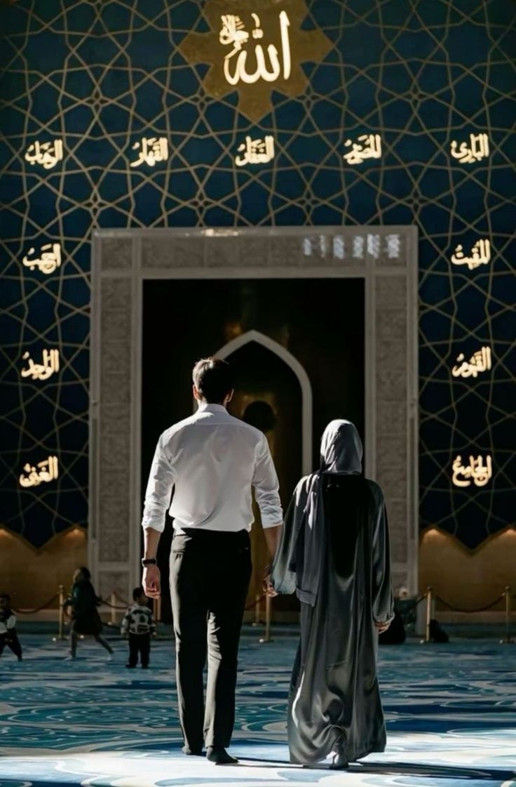 two people walking in front of a building with arabic writing on the walls and doors