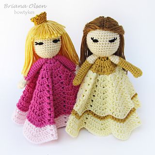 two crocheted dolls sitting next to each other