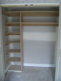 an empty walk in closet with shelving and shelves