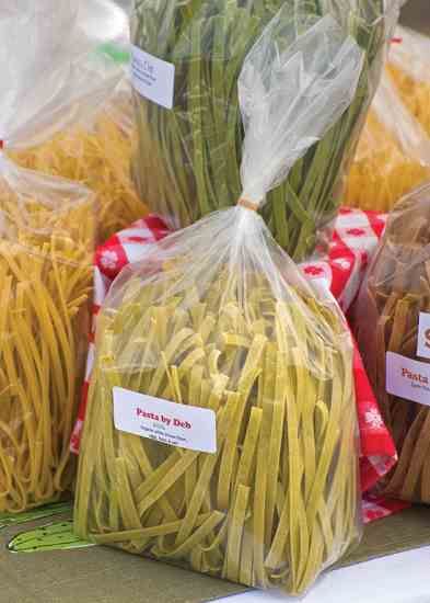 several bags of pasta sitting on top of a table