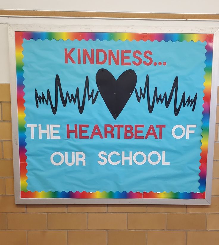 a sign that says kindness the heartbeat of our school