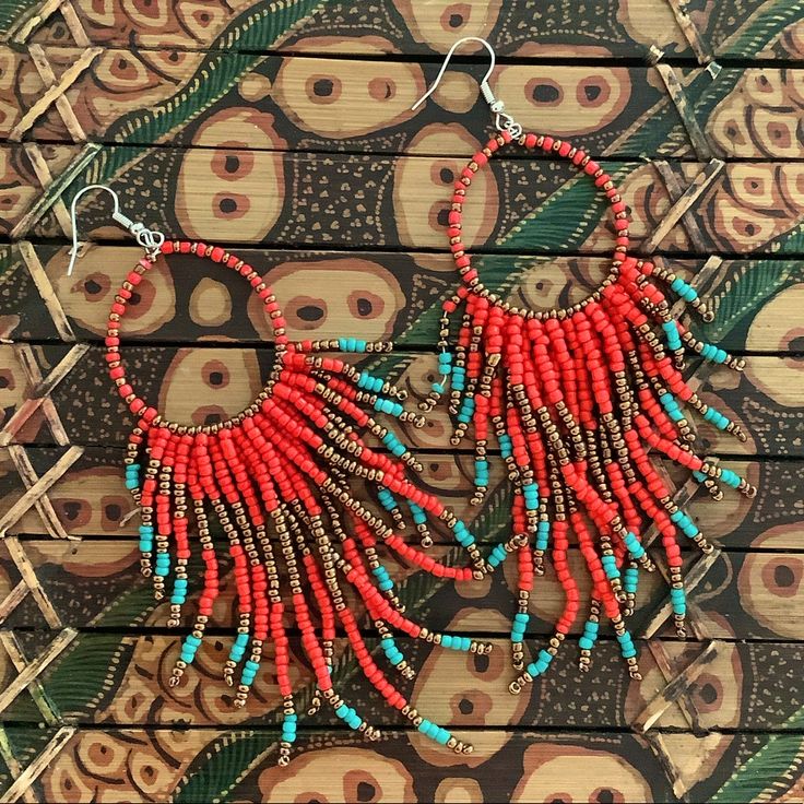 Beaded Fringe Hoop Earrings With Red, Bronze, & White Beads One Size 4-5” Long Red Round Bead Earrings For Festivals, Red Bohemian Hoop Earrings For Summer, Bohemian Beaded Coral Earrings, Red Beaded Earrings With Dangling Beads For Beach, Red Beaded Earrings For Festival With Tiny Beads, Red Hoop Earrings With Tiny Beads, Red Bohemian Beaded Earrings With Colorful Beads, Bohemian Red Beaded Earrings With Colorful Beads, Red Bohemian Earrings With Large Beads