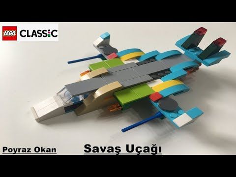 a lego model of a fighter jet on a white surface with the words,'savas ucagi '