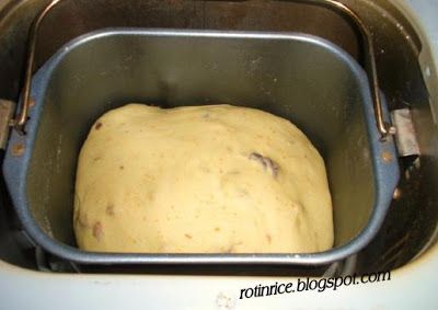 a metal pan filled with dough on top of a stove