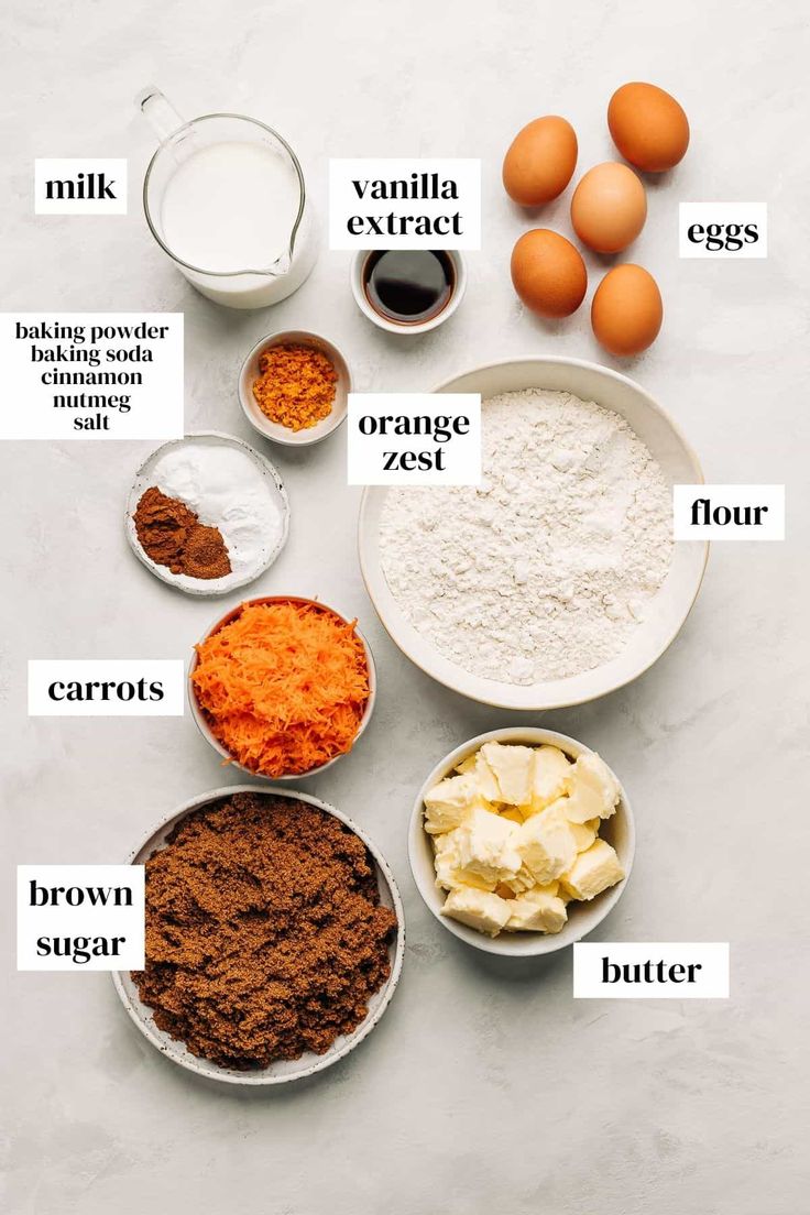 an image of ingredients to make chocolate cake recipe on a table with eggs and flour