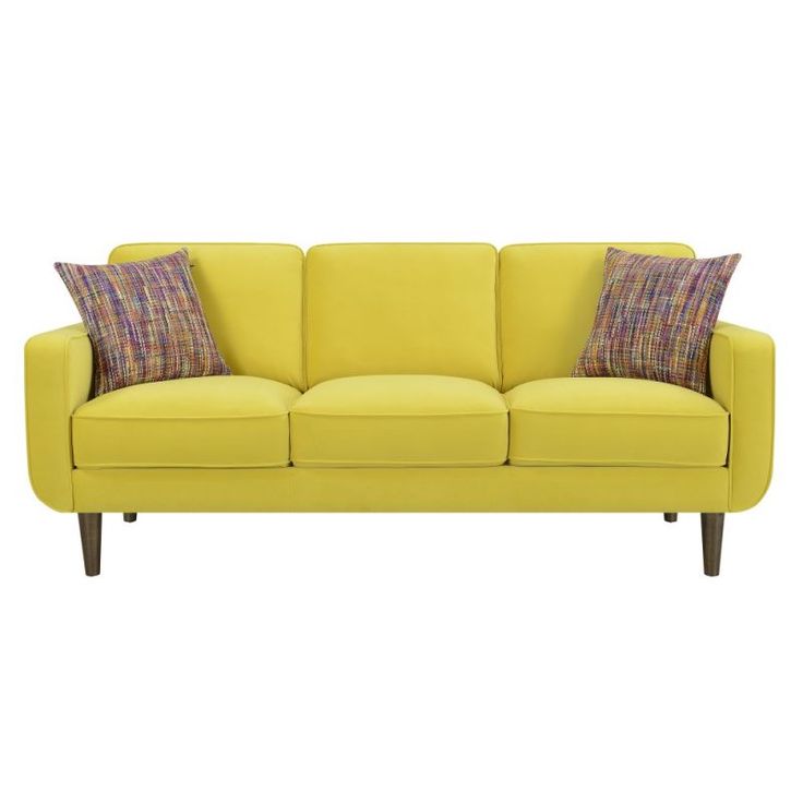 a yellow couch with two pillows on it's back and one arm facing the camera