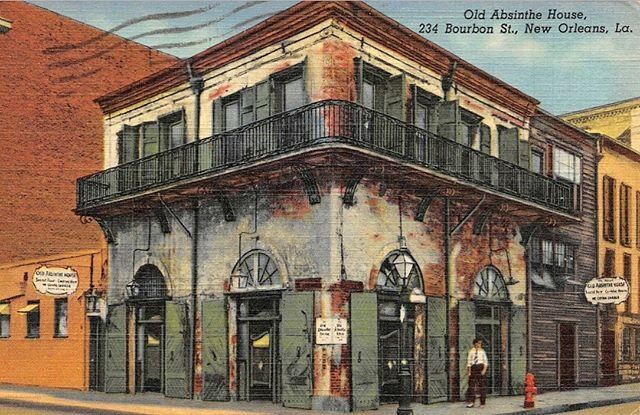 an old building with green shutters and balconies on the second floor is shown in this postcard