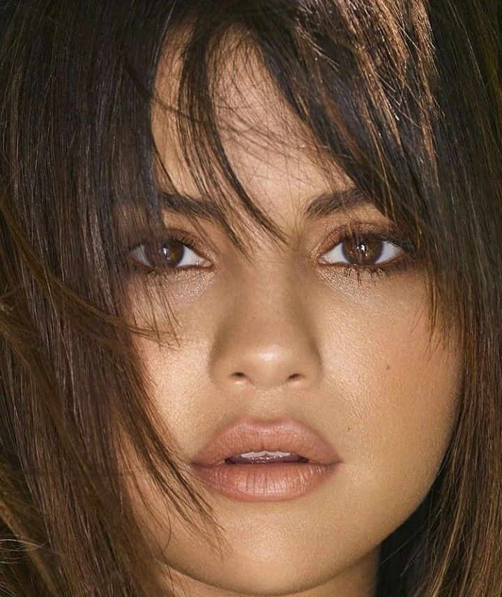 a close up of a person with brown hair