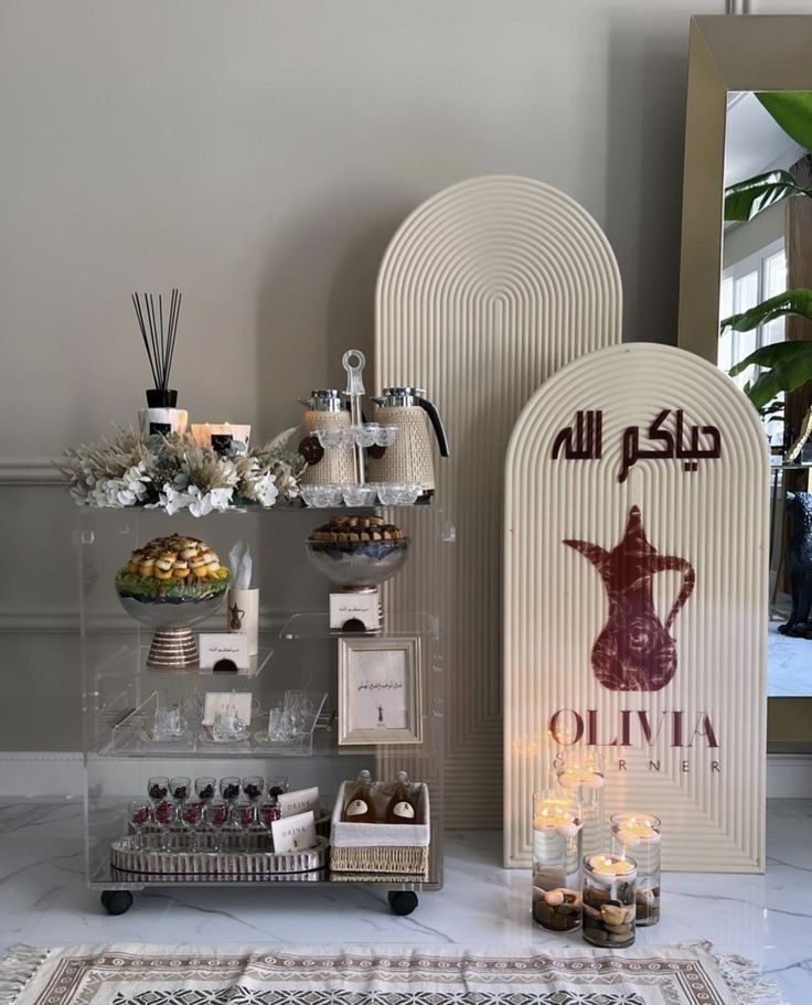 an assortment of desserts on display in front of a sign that says al nijta