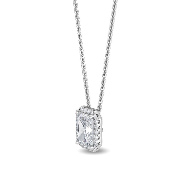 This Halo Pendant Lab Grown Diamond Necklace is sure to take your breath away. Featuring a radiant cut diamond, this lab grown necklace offers .93 ctw of sparkling brilliance. Get ready to dazzle with this timeless piece of jewelry. Center Stone: radiant cut lab grown diamond, .75 ct, F/G Color, VS1 Halo: round lab grown diamonds, .18 ct. 18", lobster clasp .93 carat total weight *This item is custom made just for you in your metal preference. *Please contact us prior to purchasing with any ques Luxury Formal Diamond Necklace With Rectangular Pendant, Luxury Diamond Necklace With Rectangular Pendant For Formal Events, Luxury Diamond Necklace With Rectangular Pendant For Formal Occasions, Classic Formal Necklace With Rectangular Pendant, Classic Formal Necklaces With Rectangular Pendant, Luxury Rectangular Diamond Cut Necklace, Luxury Diamond Necklace With Vvs Clarity And Emerald Cut, Luxury Emerald Cut Diamond Necklace With Vvs Clarity, Luxury Emerald-cut Diamond Necklace With Vvs Clarity