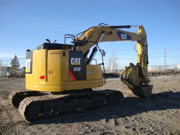 an excavator is parked in the dirt