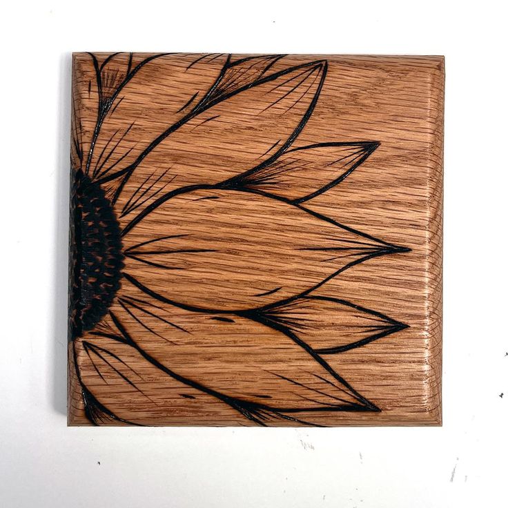 a wooden box with a sunflower painted on it