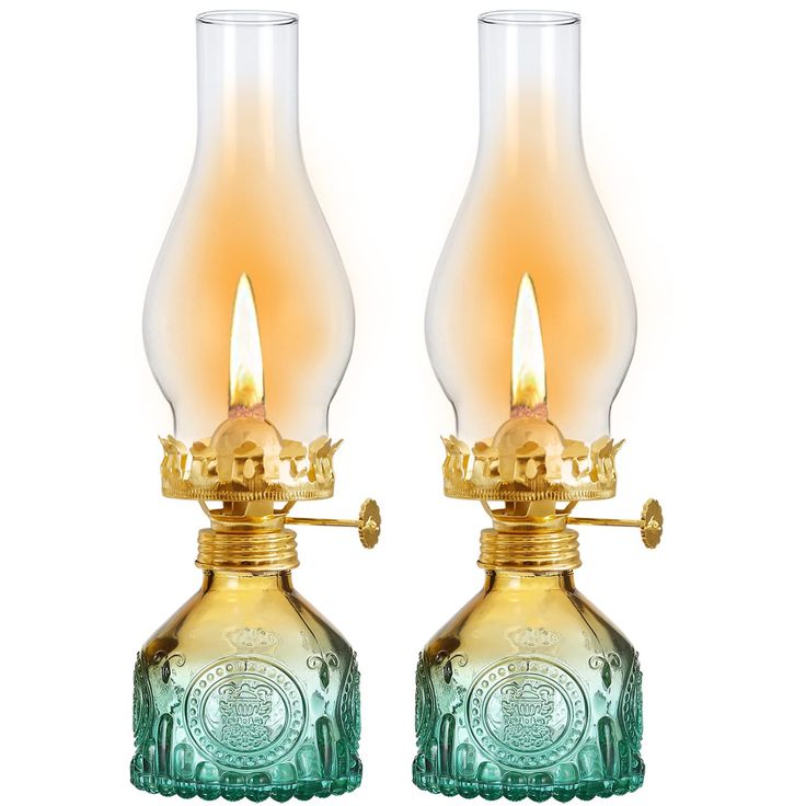 two glass lamps are sitting side by side on a white background, one is yellow and the other is green