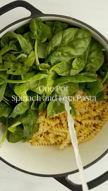 spinach and feta pasta in a skillet with the words one pot spinach and feta pasta