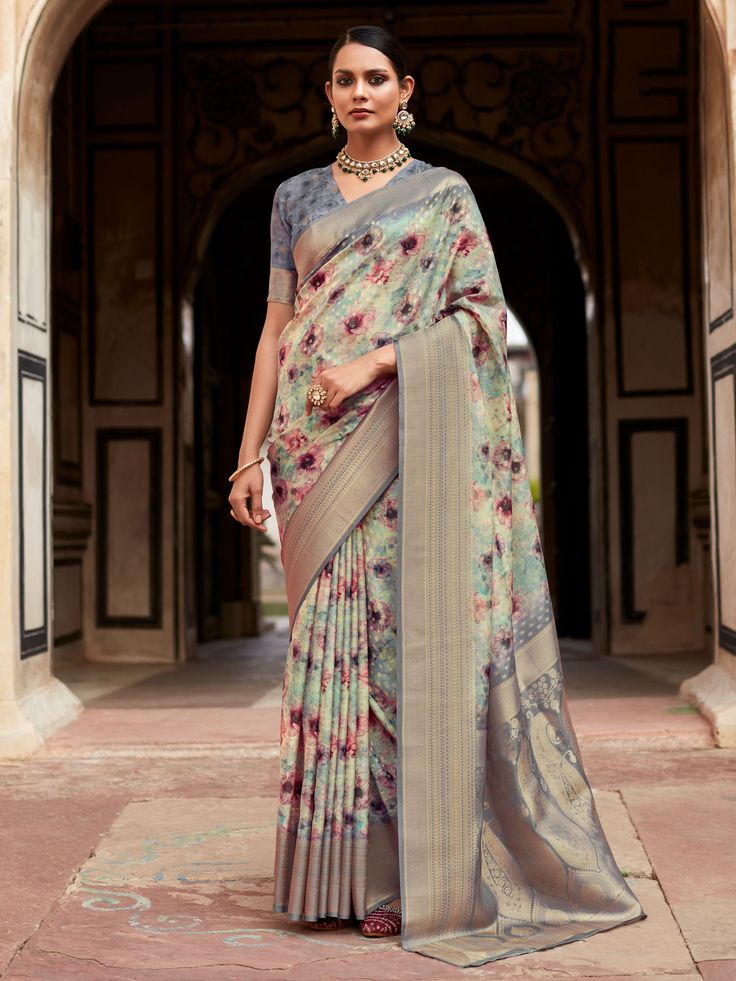 Memorialize your upcoming festivals, events, and any occasion with this beautifully printed design grey saree by giving the proper ethnic look to you. The "beautiful grey floral printed silk festival wear saree with blouse" is a stunning piece that will make you stand out in any crowd. Made from high-quality tissue silk, this saree features intricate digital print work and zari weaving border work that adds a touch of elegance to the overall look.
The saree comes with a matching grey color silk Digital Print Saree, Grey Saree, Crepe Silk Sarees, Cotton Sarees Online, Sea Green Color, Print Saree, Ghagra Choli, Saree Look, Traditional Sarees