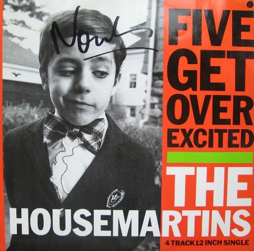 a poster with a young boy wearing a bow tie