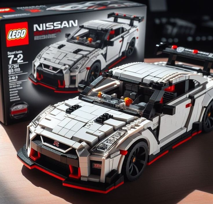 a lego nissan sports car sitting on top of a wooden table next to a box