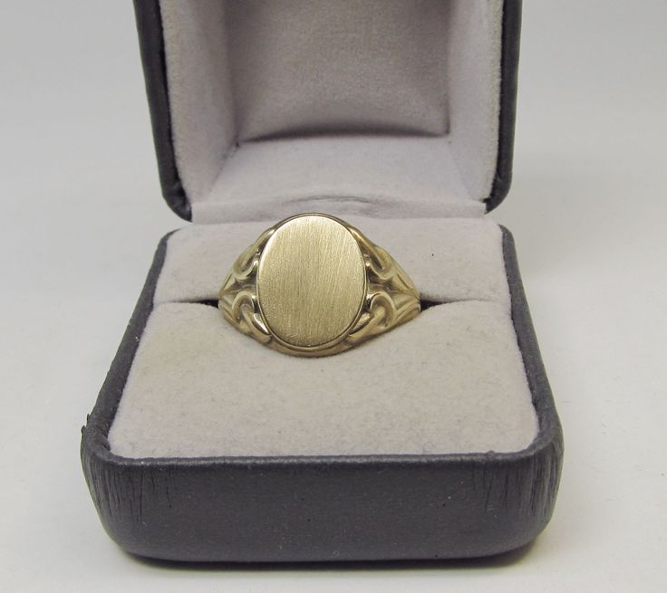 A fine example of Art Nouveau is this 14Kt yellow solid gold classic men's signet ring. The oval top measures 12 X 15 millimeters. The ring is a size 10 and it can easily be sized. Formal 14k Gold Oval Cabochon Signet Ring, 14k Gold Oval Cabochon Signet Ring For Formal Occasions, Formal Yellow Gold Signet Ring With Oval Cabochon, Classic Gold Oval Signet Ring, Formal Hallmarked Oval Cabochon Signet Ring, Antique Oval Signet Ring With Polished Finish, Gold Signet Ring With Classic Design For Formal Occasions, Formal Gold Oval Engraved Ring, Classic Yellow Gold Oval Cabochon Signet Ring