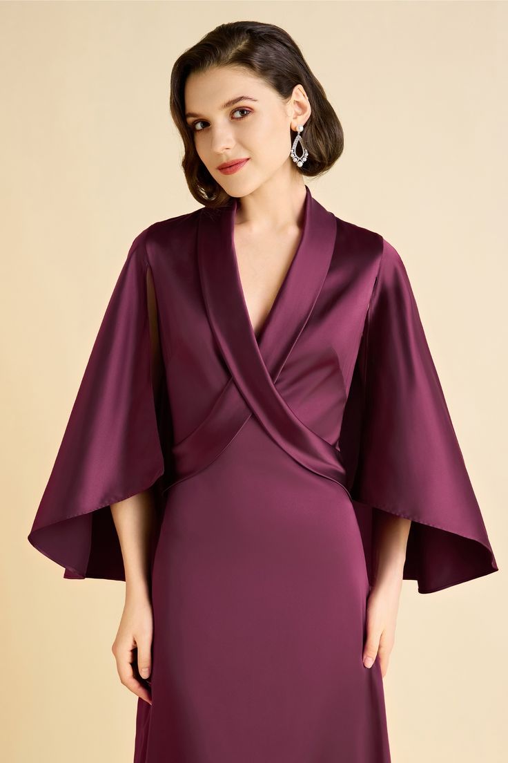 Elevate your style with our enchanting cape dress, designed to make a statement at any occasion. The sophisticated cross neckline creates a visually striking effect, while the cascading cape detail adds an element of drama and elegance, perfect for a grand entrance. The A-line dress gracefully flares out, offering a flattering silhouette that moves effortlessly with every step, exuding timeless charm and refinement. Features: Elegant cape detail Cross neckline A-line silhouette High-quality fabr Pre-draped Cape Evening Dress, Elegant Gown With Cape Sleeves, Formal Pre-draped Cape Dress, Evening Cape Dress With Pre-draped Style, Evening Dress With Cape Shape And Pre-draped Style, Elegant Cape Evening Dress For Formal Occasions, Elegant Cape Evening Dress For Formal Events, Elegant Formal Evening Dress With Cape, Cape Evening Dress With Draped Sleeves For Wedding