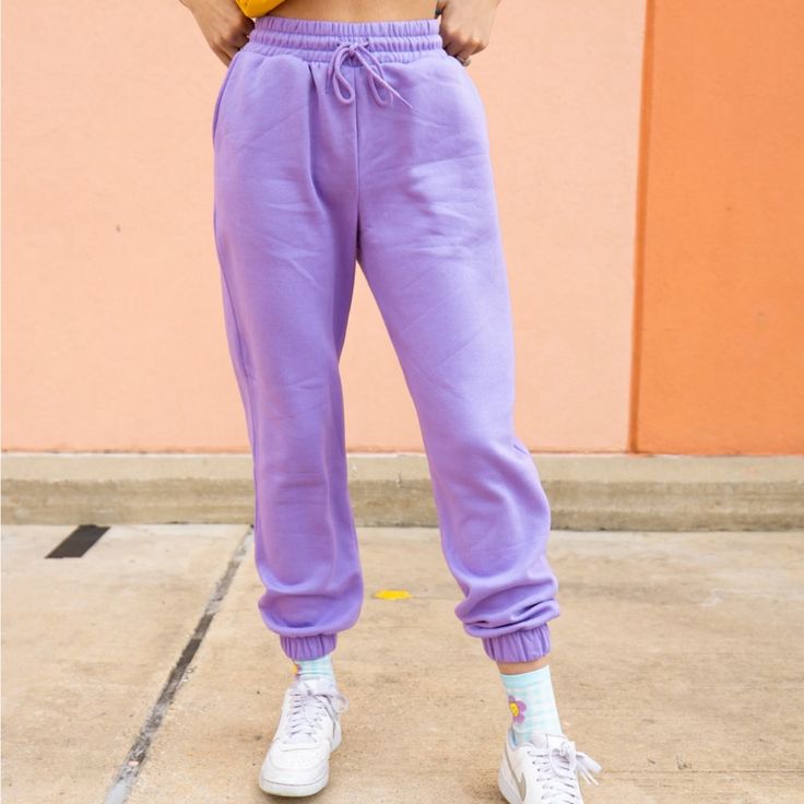 Lounge Wear But Make It Colorful! The Clemetine Sweatpants Are As Soft And Cozy As It Gets. The Perfect Pants For Running Errands, Lounging Around, Or For An Athleisure Look. Seen Paired With The Clear As Day Lounge Tank And The Checkered Daisy Socks. True To Size. 53% Cotton 45% Polyester 2% Spandex Model Is 5'7 Wearing Size. Trendy High Waist Cotton Joggers, Trendy High-waist Cotton Joggers, Purple Elastic Waist Ankle Pants, Purple Straight Leg Pants With Elastic Waistband, Purple Ankle-length Bottoms With Elastic Waistband, Purple Ankle-length Pants With Elastic Waistband, Ankle-length Purple Pants With Elastic Waistband, Purple Sweatpants With Elastic Waistband, Sporty Purple Sweatpants For Spring