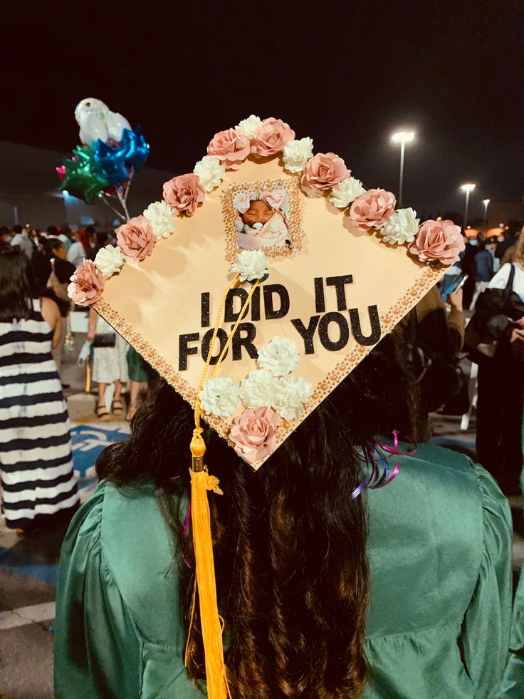 a graduation cap that says i did it for you with flowers on the front and side