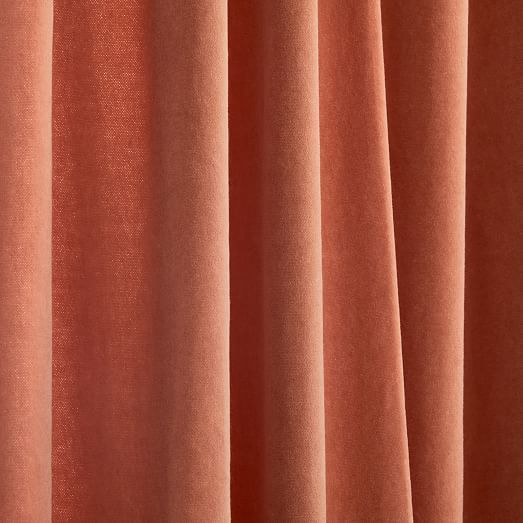 a close up view of a pink curtain