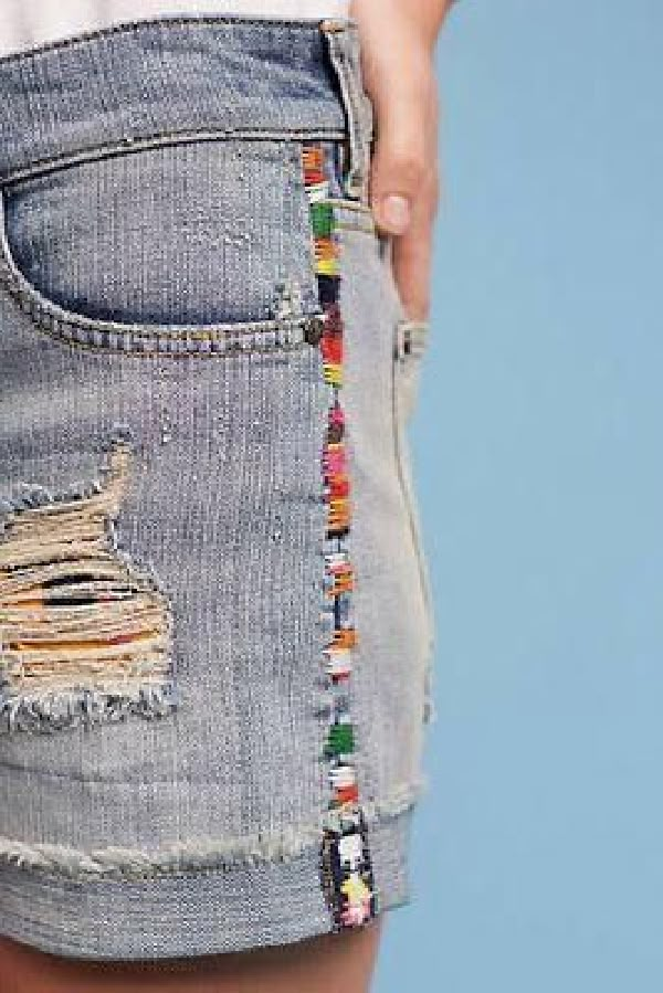 a woman's shorts with colorful beads on the side