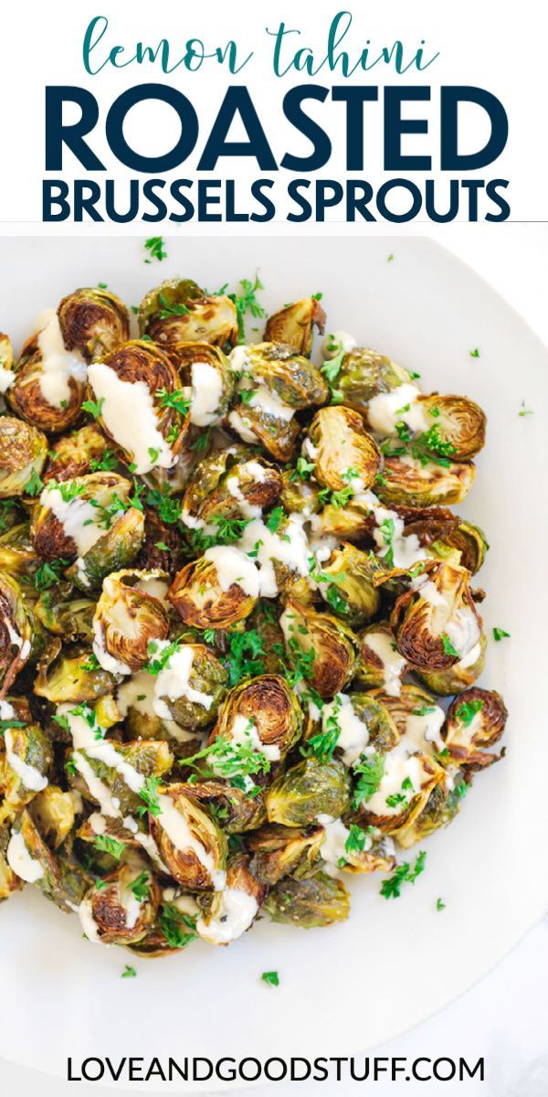 roasted brussel sprouts in a white bowl with parsley on top