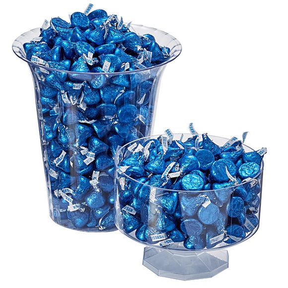 two clear vases filled with blue candy