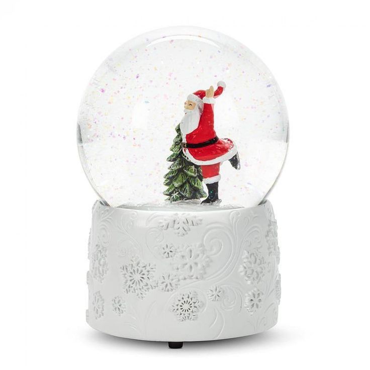 a snow globe with a santa clause on it and a christmas tree in the middle