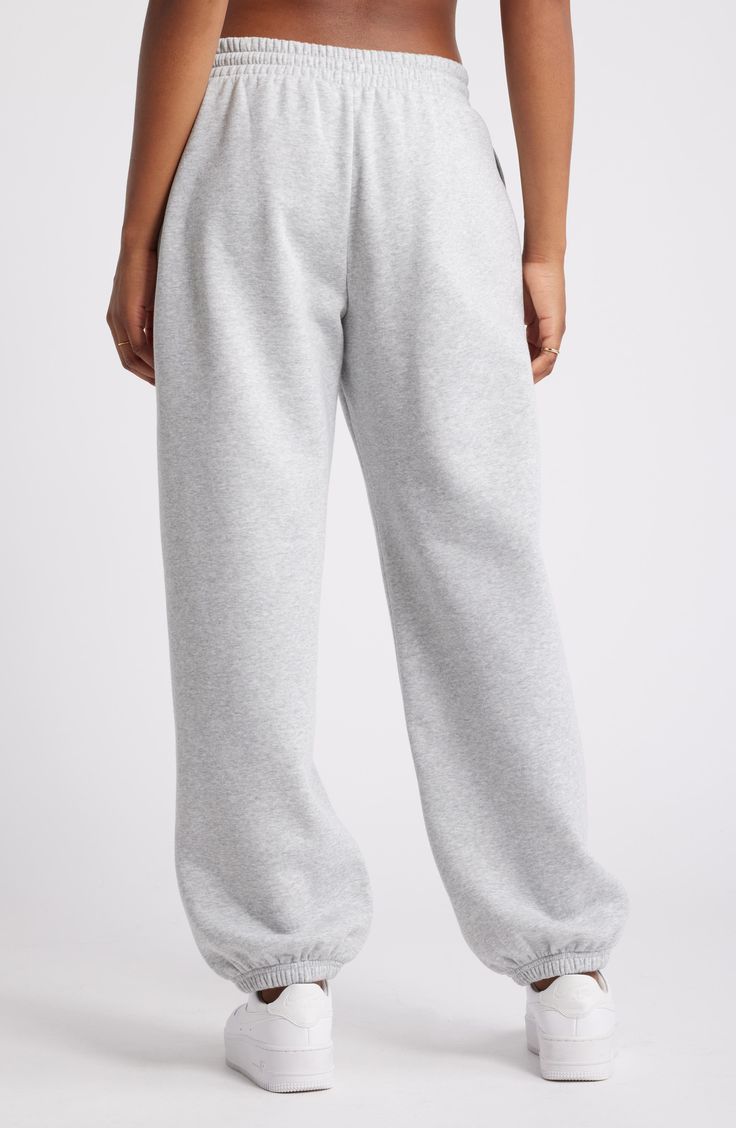 Get into cozy mode with these oversized sweatpants made with soft fleece and the essential elastic waist. Elastic/drawstring waist 68% cotton, 32% polyester Machine wash, tumble dry Imported Not available for sale and shipment to Germany Fleece Sportswear Bottoms For Loungewear, Basic Relaxed Fit Sweats For Loungewear, Fleece Bottoms With Elastic Waistband For Loungewear, Cotton Activewear With Elastic Cuffs For Leisure, Comfortable Cotton Activewear With Elastic Cuffs, Comfortable Fleece Sweatpants With Elastic Cuffs, Comfy Fleece Joggers With Relaxed Fit, Fleece Sweatpants With Comfort Waistband For Loungewear, Fleece Sweatpants With Elastic Waistband For Loungewear