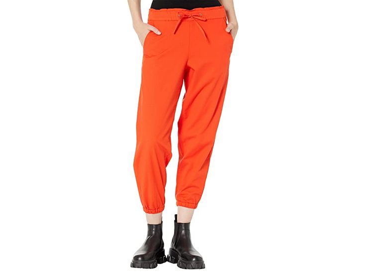 Levi's(r) Womens Off Duty Joggers - Women's Clothing : Comfy Orange Enamel : Boost your chill style wearing the super-comfy and stylish Levi's Womens Off Duty Joggers. Mid-rise, elasticized waist with drawstring closure. Elasticized cuffs. Tapered leg. Front slant pockets and back patch pockets. 59% cotton, 38% viscose, 3% elastane. Machine wash, tumble dry. Imported. Measurements: Waist Measurement: 28 in Outseam: 35 in Inseam: 25 in Front Rise: 10 in Back Rise: 13 in Leg Opening: 10 in Product Casual Spring Joggers With Pull-on Style, Cotton Joggers With Pull-on Style, Cotton Joggers With Loosely Fitted Hips, Sporty Joggers With Pockets For Casual Wear, Cotton Joggers With Loosely Fitted Hips And Pull-on Style, Spring Utility Sweatpants With Relaxed Fit, Leisure Cotton Pull-on Joggers, Spring Utility Style Relaxed Fit Sweatpants, Fall Utility Joggers With Relaxed Fit